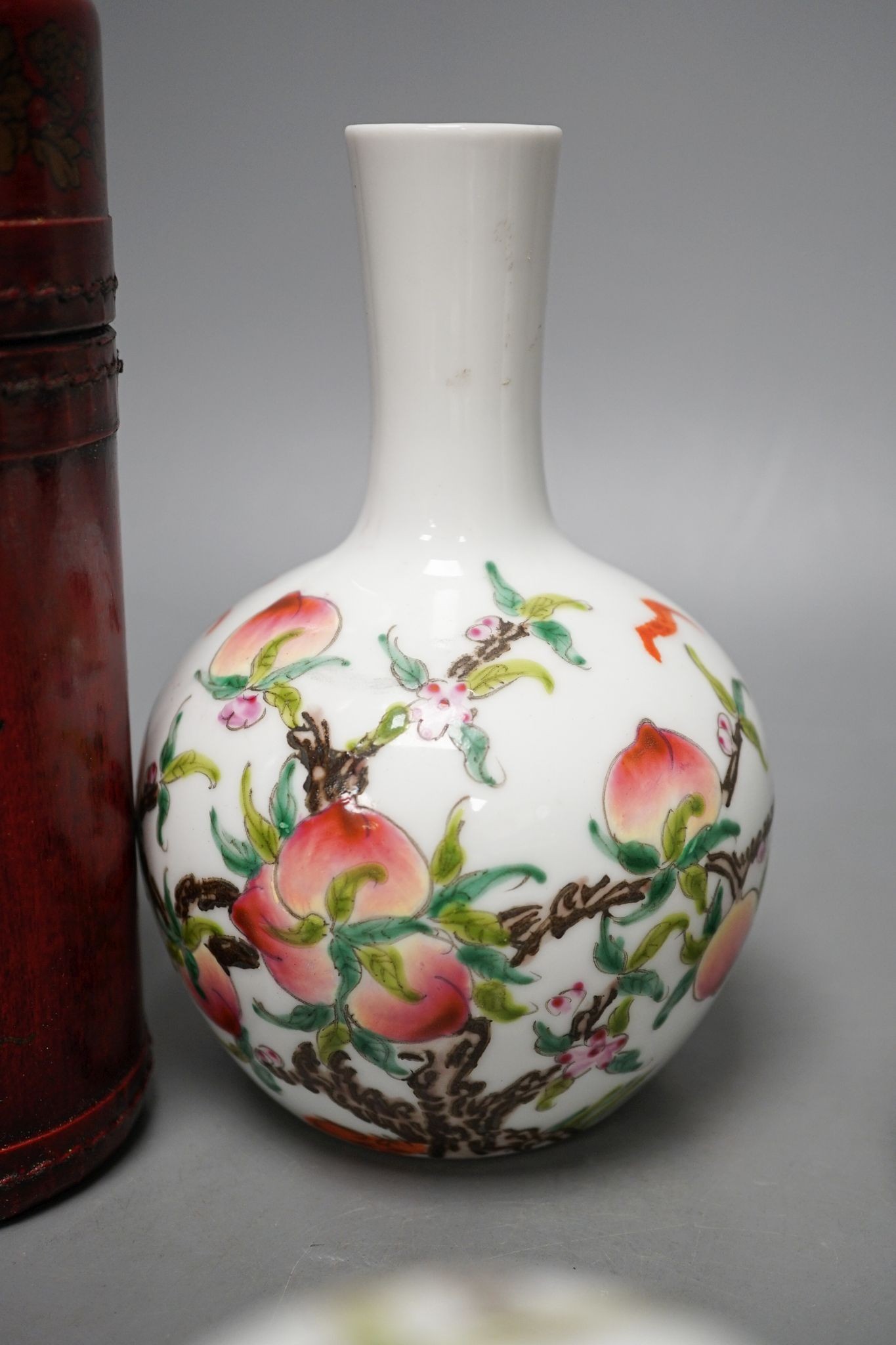 A pair of Chinese famille rose ‘peach’ bottle vases, 17cm, a ‘phoenix’ jar and cover, two porcelain cups and a boxed set of bamboo tallies or counters (6)